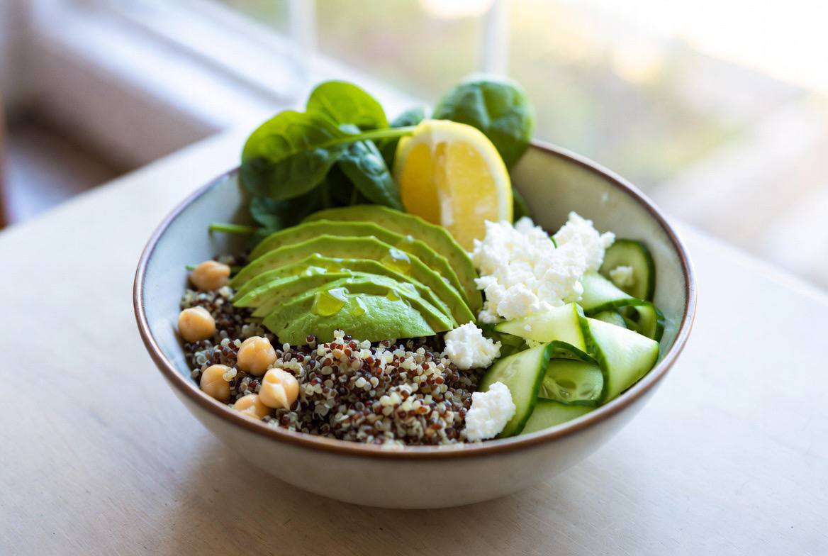 Grain bowl with avocado, chickpeas, and feta